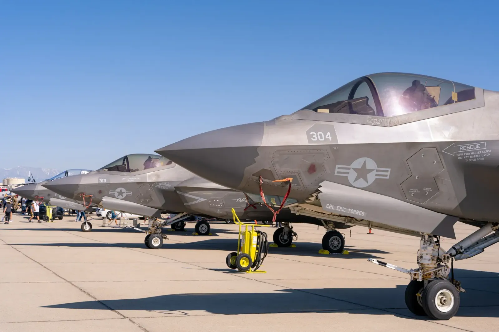U.S. military fighter jets lined up on an airstrip
